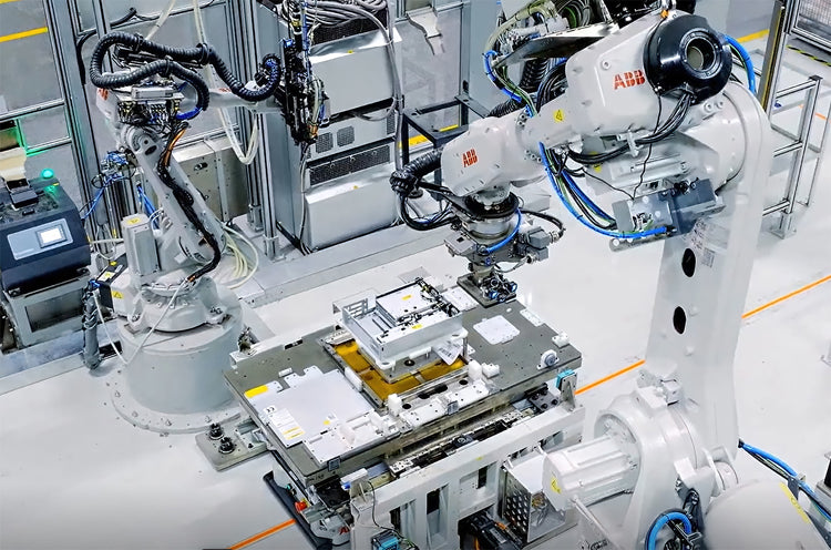 ABB robotic vision cell performing precision manufacturing tasks guided by physical AI